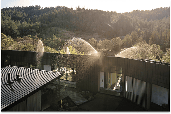 Home in Healdsburg equipped with roof and eave sprinklers protecting against wildfire embers.