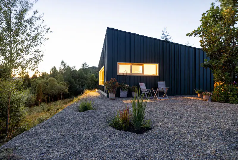 A photo depicting a house featuring fire-resistant materials and defensible space landscaping.