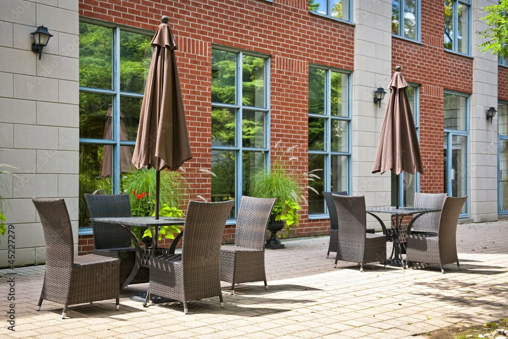 A photo showing a business patio with cafe seating and windows at risk from wildfire radiant heat.
