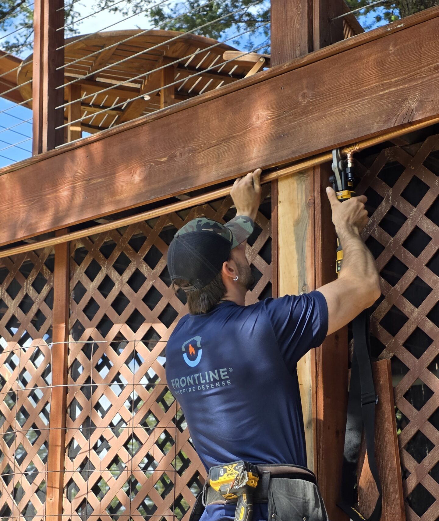 Certified Partner Installer, Montana Wildfire Sprinkler Systems working on a home.
